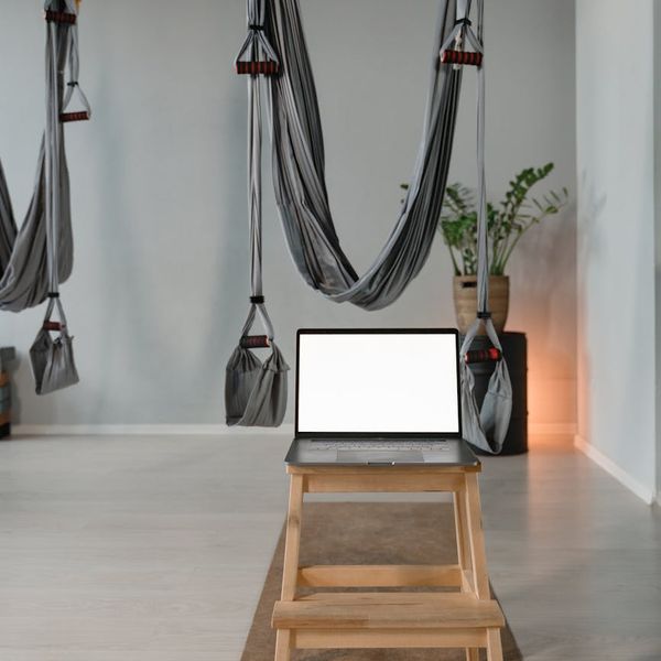Person meditating peacefully in a calm, modern environment.